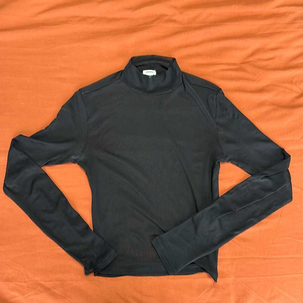 Sheer mock neck tip